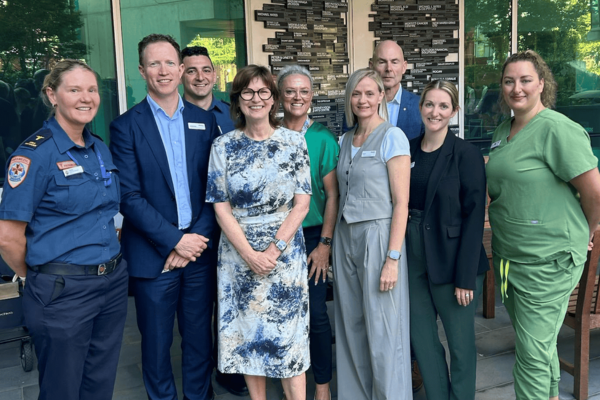 Mary-Anne Thomas, Cameron Goodyear with staff members from Austin Health and Ambulance Victoria.